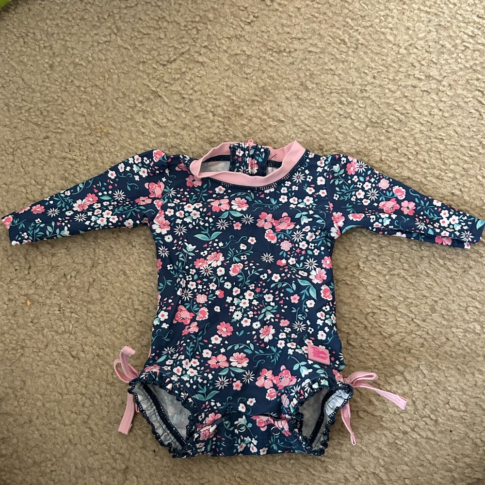 Ruffle Butts Moonlit Meadow one piece rash guard